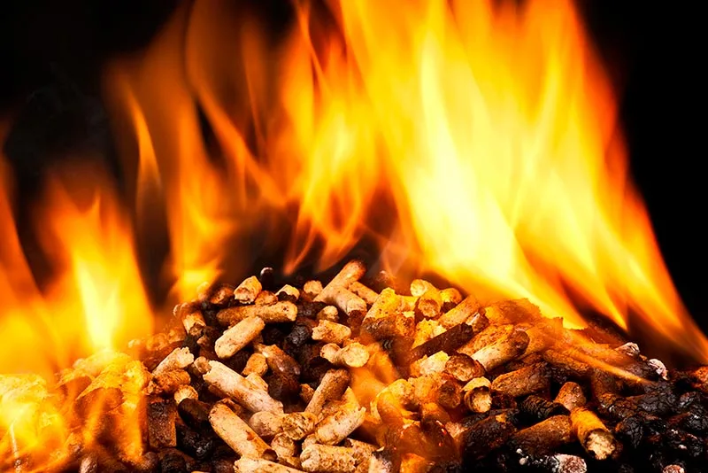 a pile of wood pellets on fire